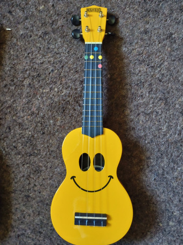 Yellow ukulele with - yellow, smiley