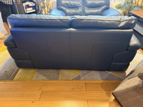 Identical navy leather sofas - identical,