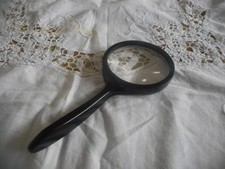 Old magnifying glass, black