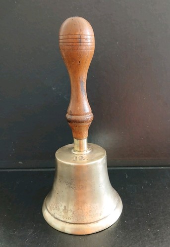 Vintage brass hand bell - hand,