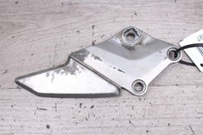 Footrest retaining plate left