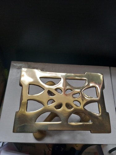 Brass three legged trivet - a,