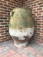 A large continental antique terracotta olive pot lots of age related patina.