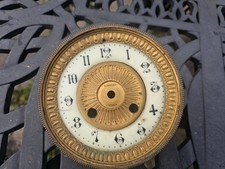 Antique French porcelain enamel clock dial with gilt bezel and center clockmaker
