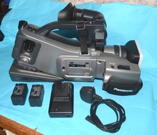 PANASONIC AG-DVC15 PROFESSIONAL MINI-DV VIDEO CAMERA WITH CHARGER AND BATTERIES.