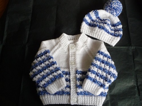 Hand knitted baby - hand,