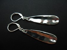 A PAIR OF TIBETAN SILVER