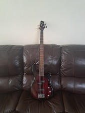squier by fender .4 string bass guitar