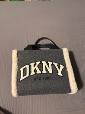 Dkny fluffy tote bag with long strap inside bag that can be detached if wanted. 