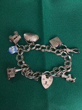 VINTAGE Sterling Silver Charm Bracelet -Includes 1 Open Church By NUVO - 31 gram