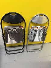 2 Fold Up Chairs. Brand New. USA Photo Seat Themed. As Shown. In Plastic & Metal