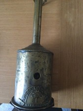 Antique brass windup "bottle