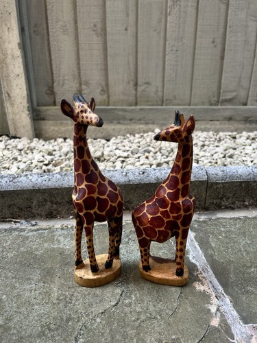 Hand carved wooden giraffe - hand,
