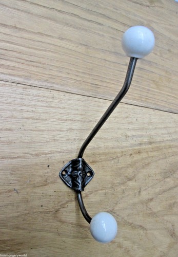 Antique iron coat hooks - coat,