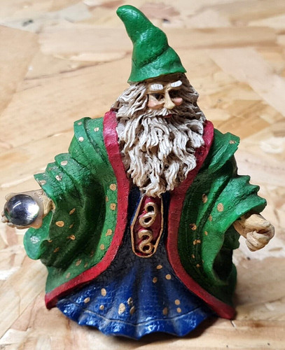 Small wizard figurine with orb - wizard,