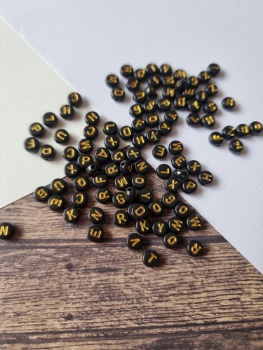 7mm black beads with - beads, gold