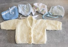 Hand knitted dolls clothes to