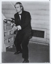 David McCallum holding gun