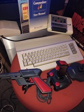 Commodore 64 + Joysticks + Light Gun + Tape Recorder + Power Supply + Manuals