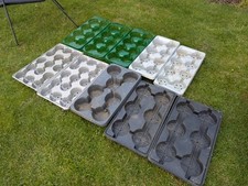 Bundle of used large plastic plant trays. Garden equipment 