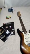 Fender Guitar With Fender Amp Also With The Leads,plectrums And Learning Books