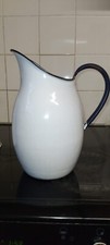 white vintage enamel jug with