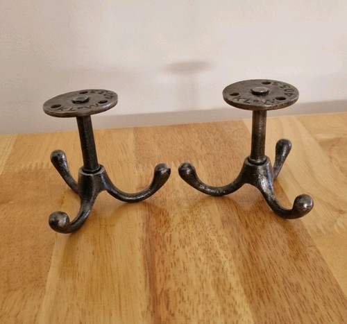 Two vintage cast iron swivel