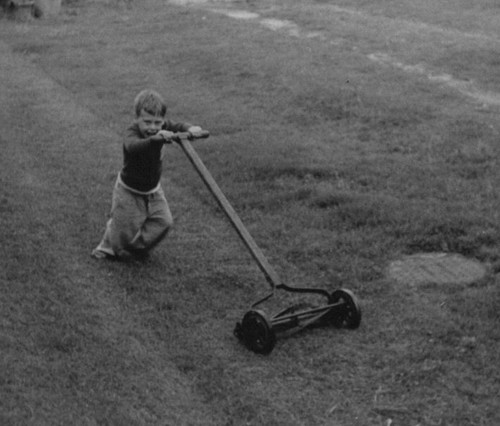 1950s boy pushing - pushing, mower
