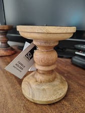 One Pale Wooden Pillar Candle