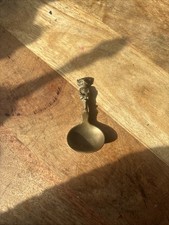 A vintage brass tea caddy