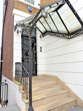 Glass Door Canopy in Wrought
