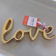 Bombay Duck cast "love"word in gold brass colour room plaque decoration