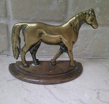 ANTIQUE FLATBACK BRASS HORSE ON STAND. 4" HIGH. CLOCK/MANTELPIECE GARNITURE?
