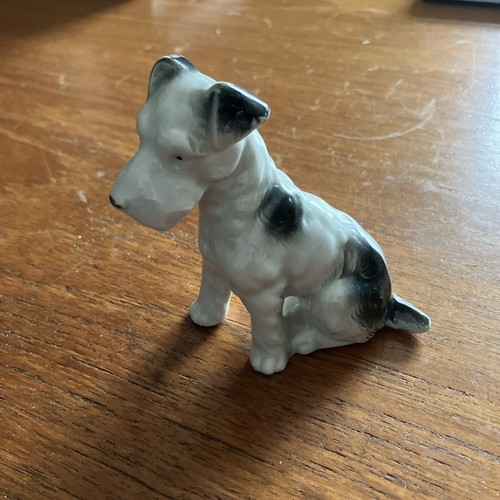 Porcelain figurine sitting - figurine,