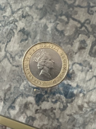 Coin with queen and - coin,