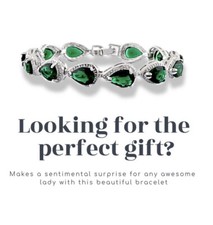 White gold finish emerald and