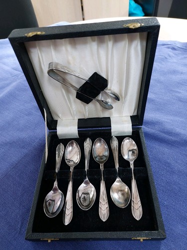 Silver teaspoons with sugar