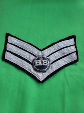 Military chevron rank badge with HS in centre 