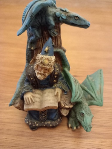 Resin seated wizard reading - seated,
