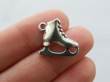 4 Ice skate charms antique