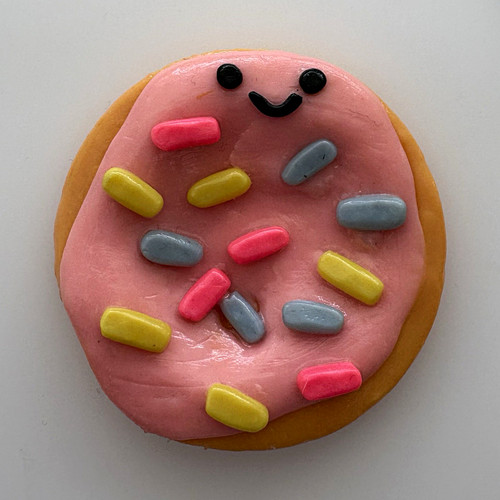 Pink smiling iced doughnut - pink,