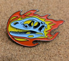Flaming Deinonychus Dinosaur Skull Enamel Pin Badge. 4cm Long. Excellent Cond.