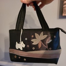 Radley black leather handbag with dog charm used but in very good condition