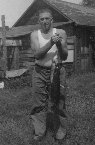 1950s man holding - man,