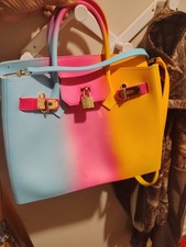 Hard shell multi colored purse