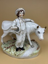 Antique Staffordshire pottery figurine, young man with cow