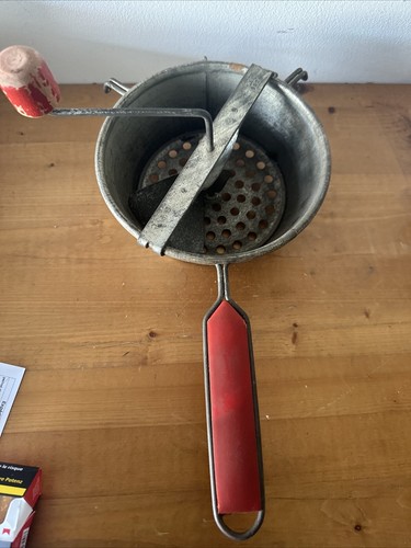 Old metal vegetable masher - vegetable,