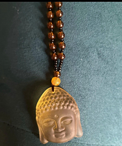 Carved buddha head amulet - carved,