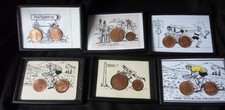 SELECTION OF FRAMED BICYCLE PICTURES WITH OLD COINS AS WHEELS
