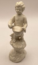 Antique White Figurine Of A